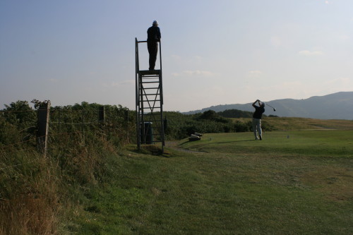 Tom Cade follows Rob Perry's tee shot from a siting tower on No. 8 at North Wales Golf Club.