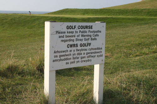 Public walking paths through Nefyn & District Golf Course come alongside and even between fairways.