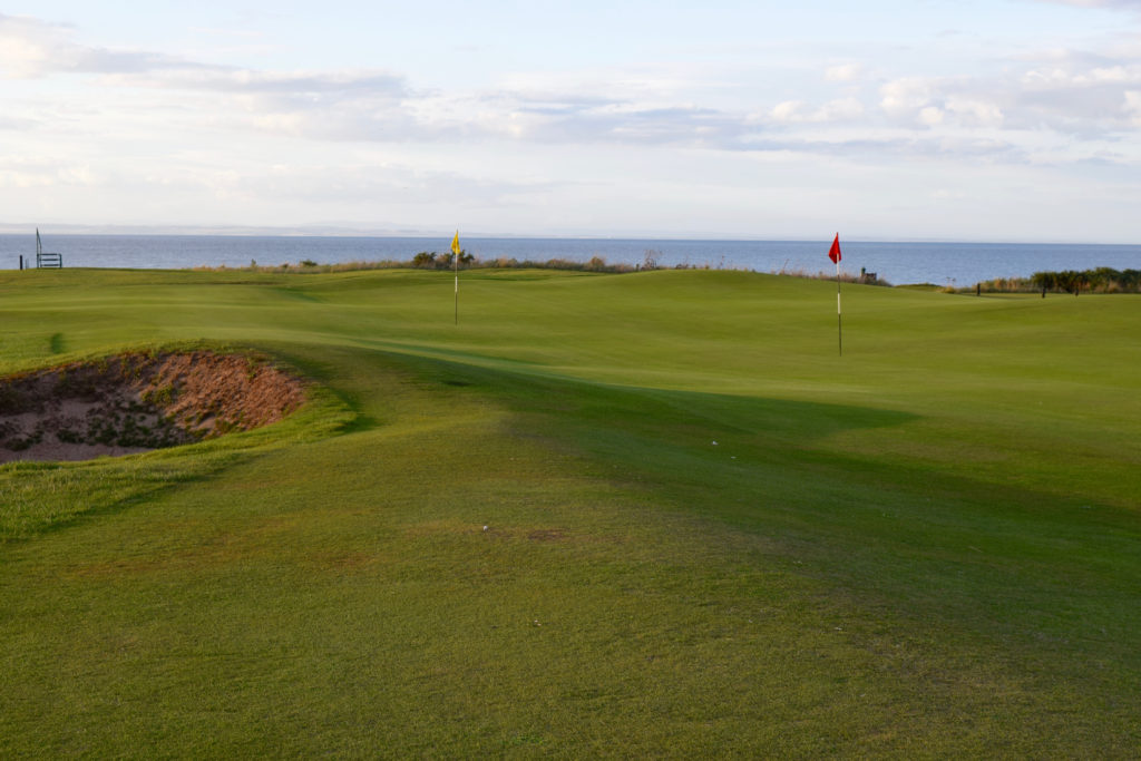 The No. 8 (yellow_ and No. 11 holes share a double green at Balcomie Links near Crail.