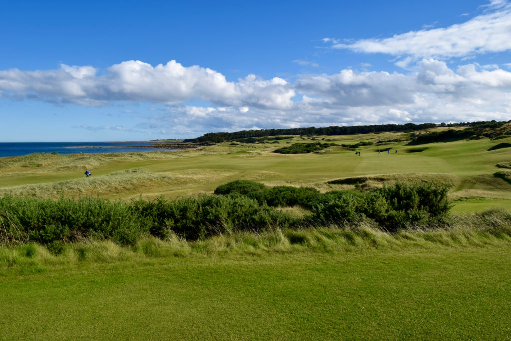 Golfers play the No. 6 fairway (right), which passes above the No. 17 fairway at Kingsbarns Golf Club.