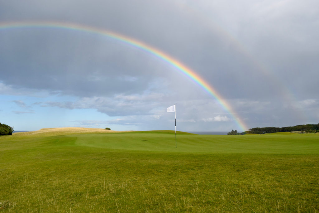 A double rainbow over the ninth green at Kingsbarns Golf Club in east Scotland, the North Sea beyond.